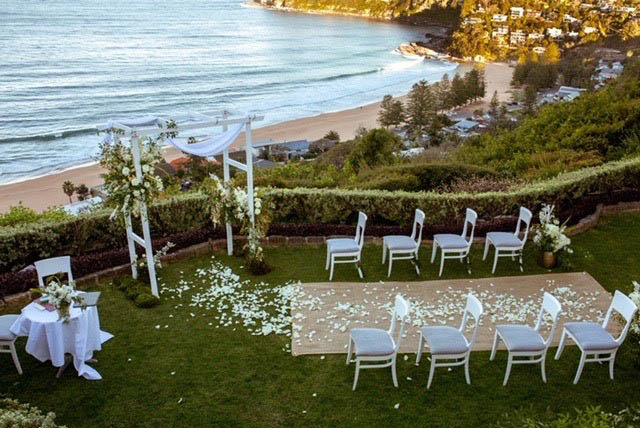 lovely wedding with view of beach and sunset