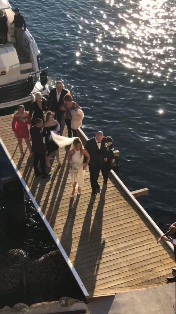 Wedding guests walking on dock