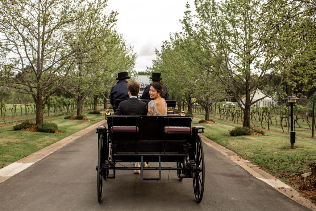 Bride and groom with a horse and carriage