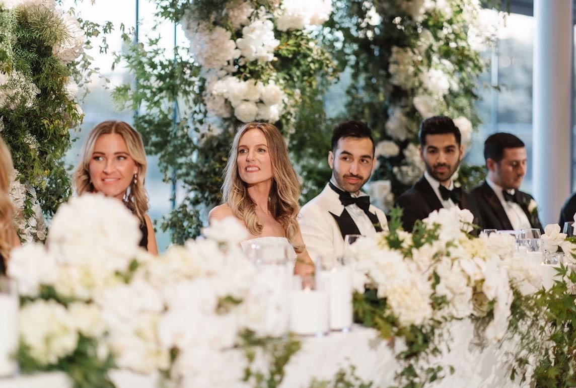 Wedding party at table with florals, quality Sydney wedding with Luxe Unforgettable Events