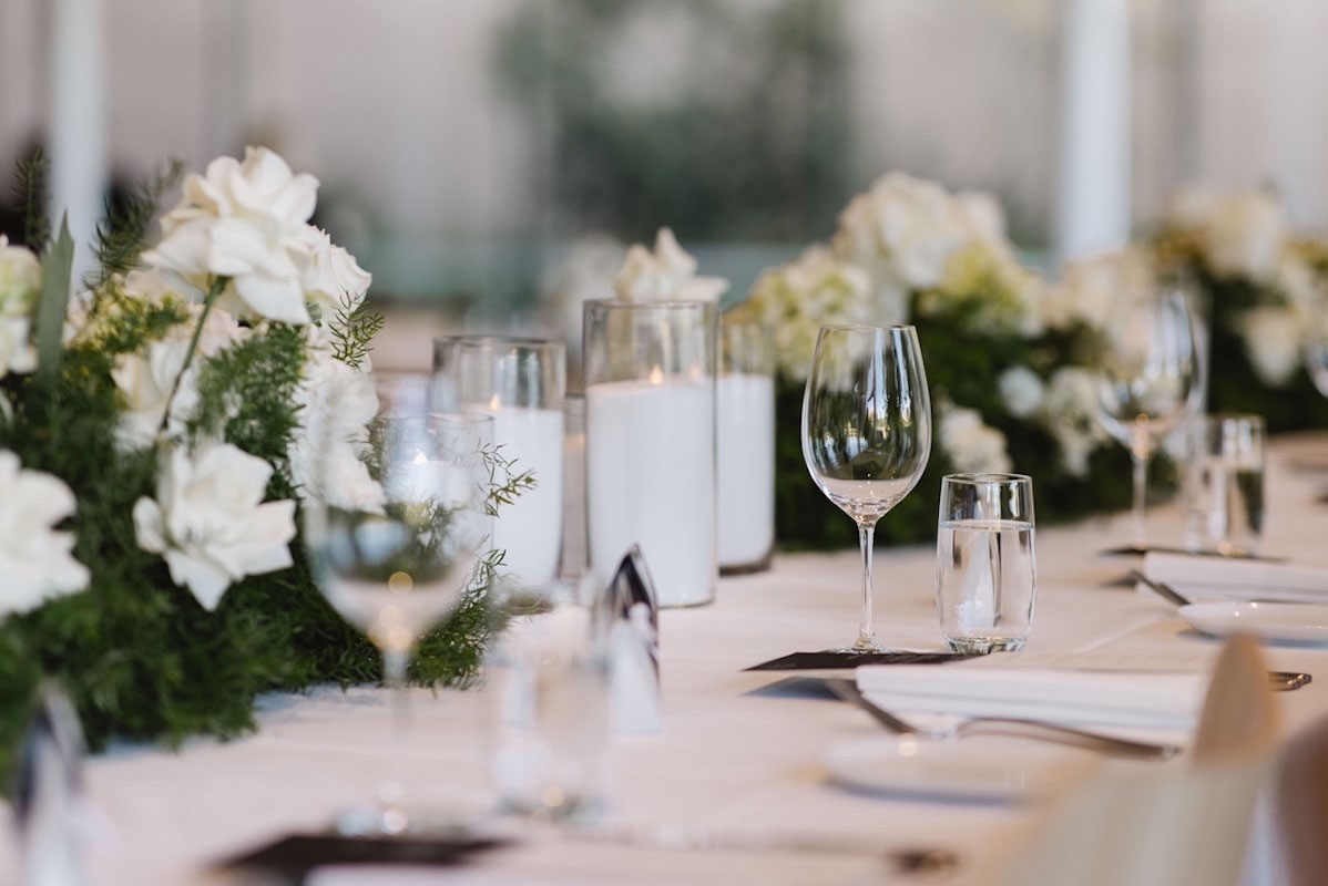 Wedding table with glasses and flowers